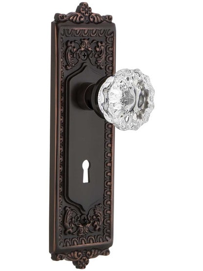 Egg and Dart Door Set with Fluted-Crystal Glass Knobs and Keyhole in Timeless Bronze.